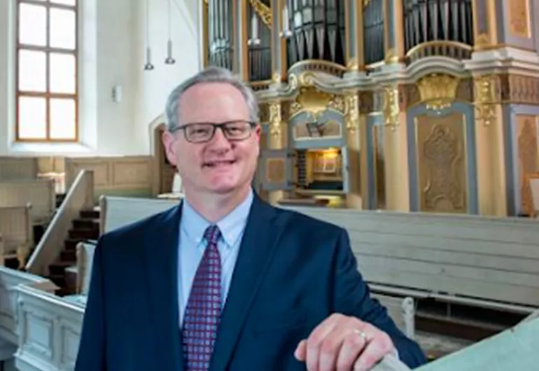 Dean Billmeyer smiling in a light 