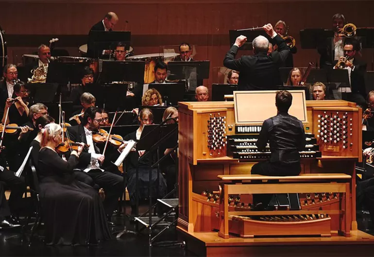 Zelek plays organ on stage with the Jacksonville Symphony