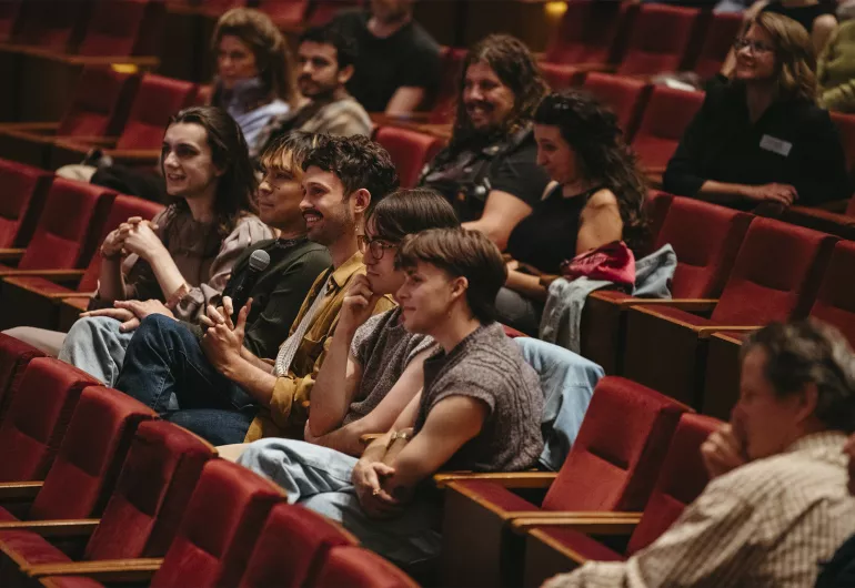 Students participate in the Q&A after a performance.