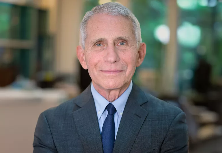 Headshot of Dr. Anthony Fauci wearing a dark suit and tie.