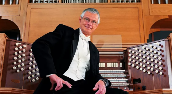 Hector sitting at the organ