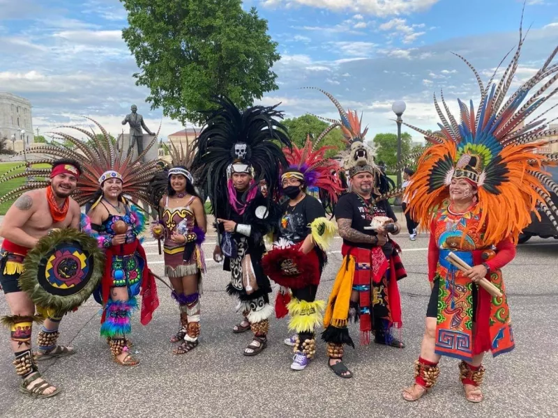 Group of performers smile for the camera