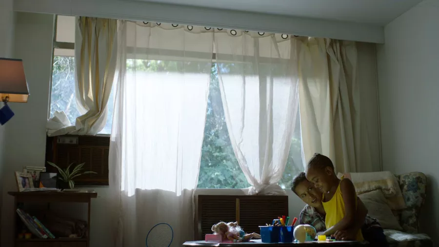 Rise, Again production still of woman and daughter in sunlit room